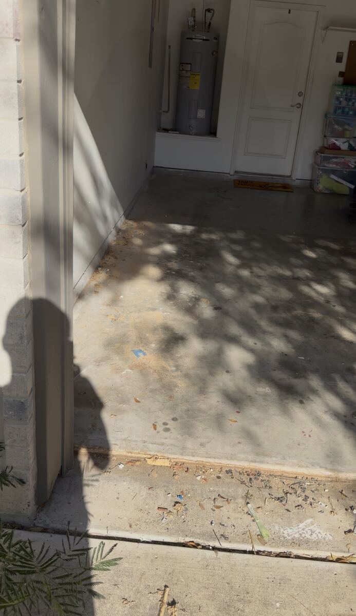 Clean, empty garage floor after junk removal service in San Antonio, TX